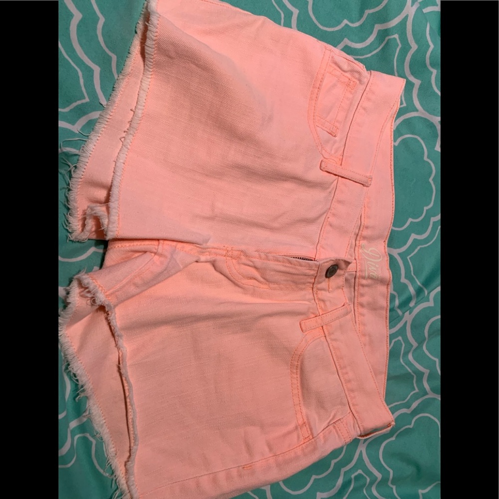 Neon pink jean shorts. Never worn.